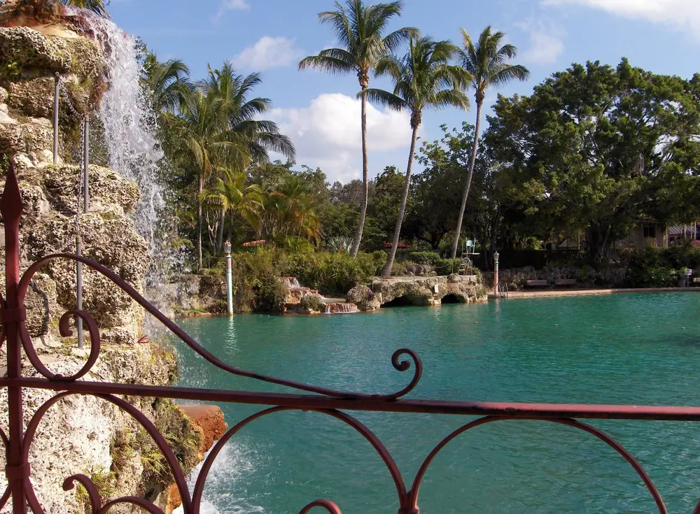 Coral-rock waterfall and palms at the Venetian Pool in Coral Gables, FL